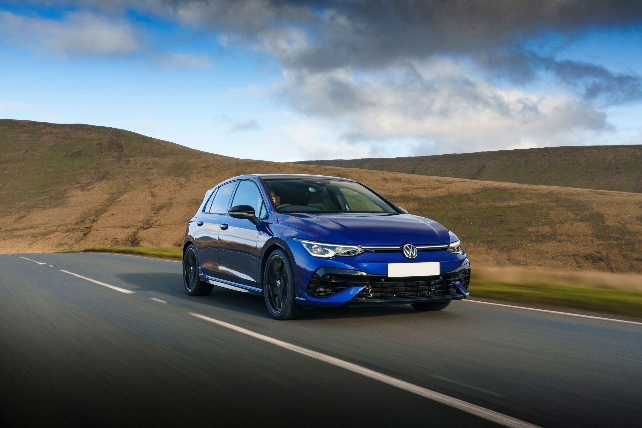 Blue VW Golf R 20 years driving