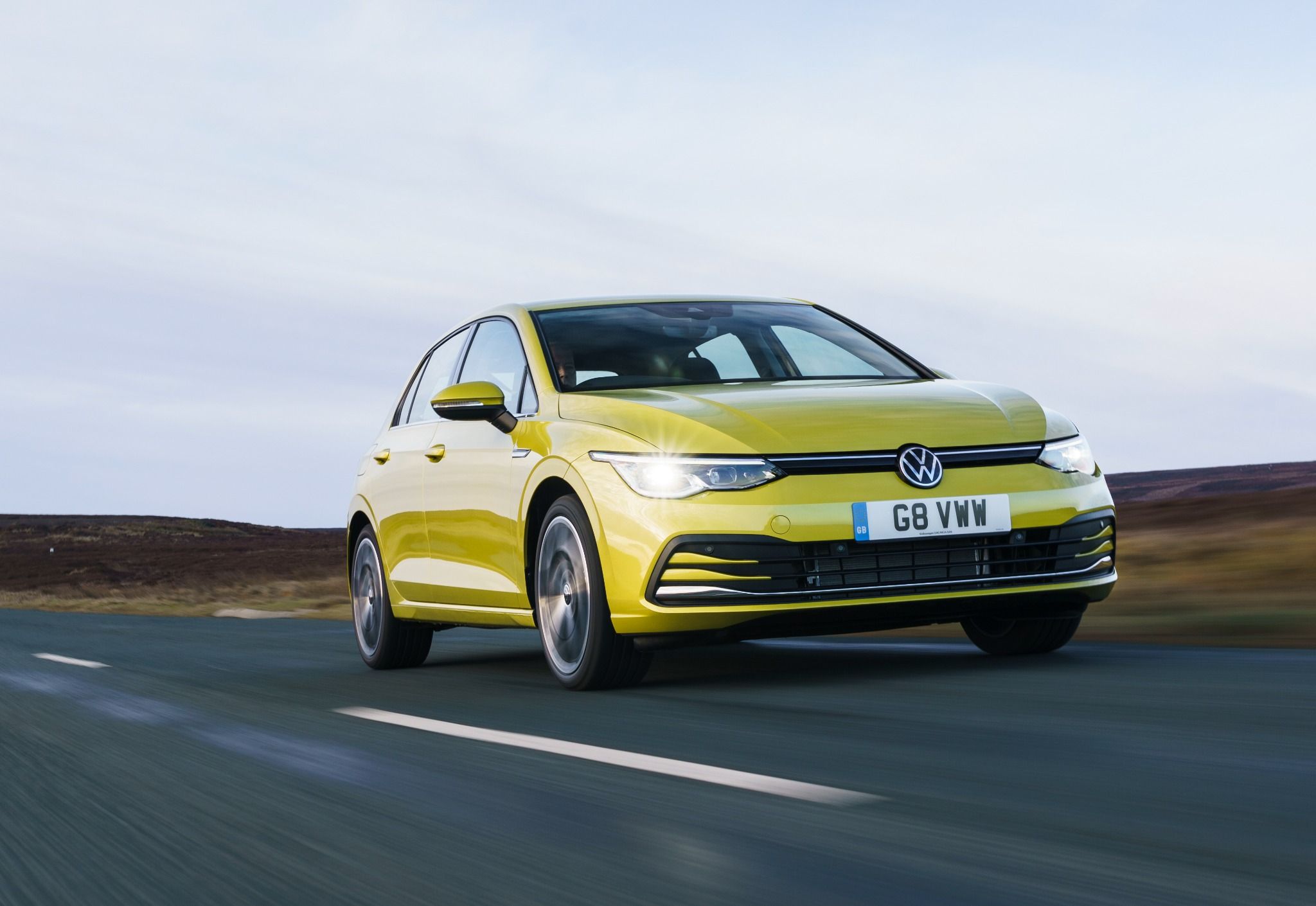 Volkswagen golf driving along a road