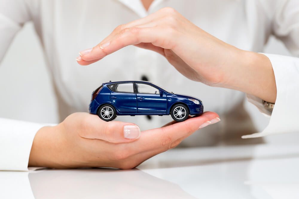 person holding toy car