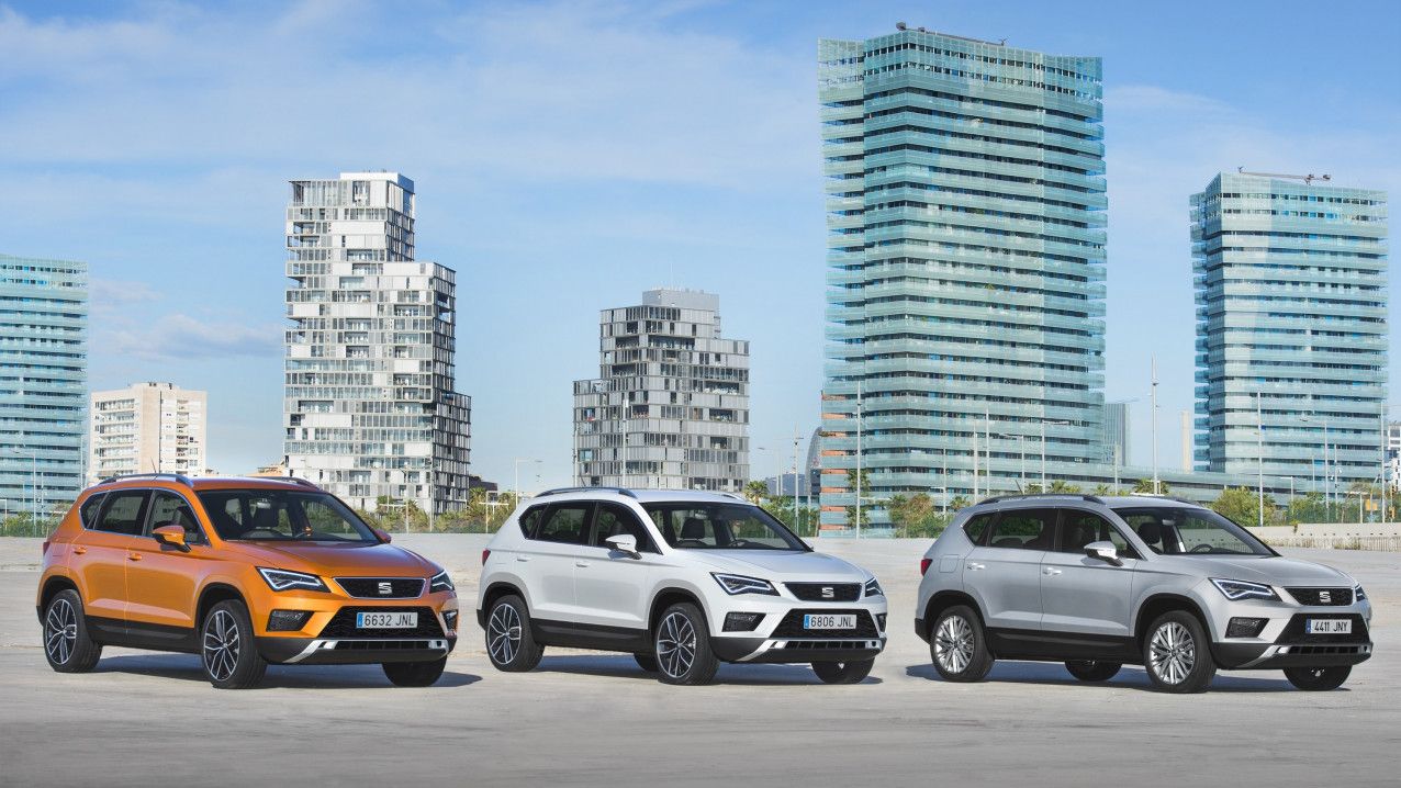 Green, White and Silver SEAT Ateca lined up