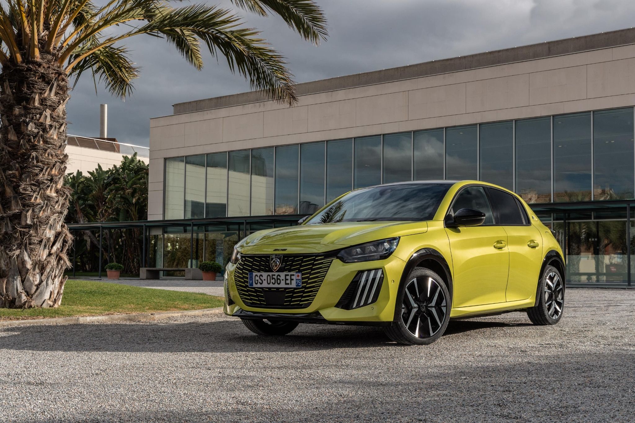 Yellow Peugeot e-208