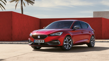 Red SEAT Leon hatchback exterior front parked