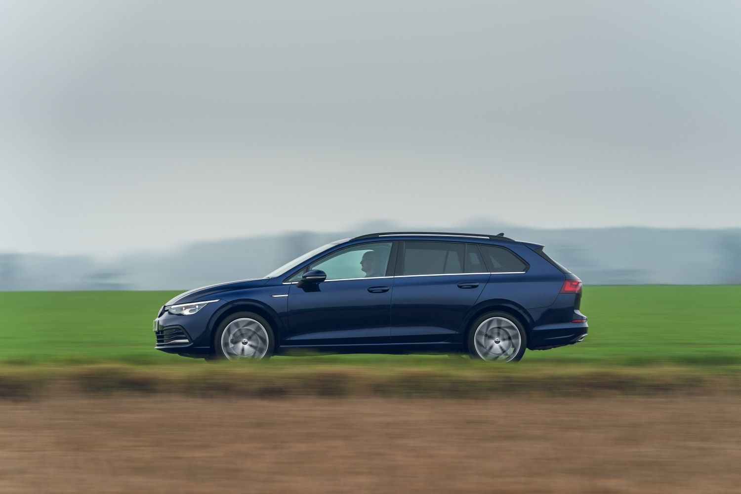 side view blue vw golf estate