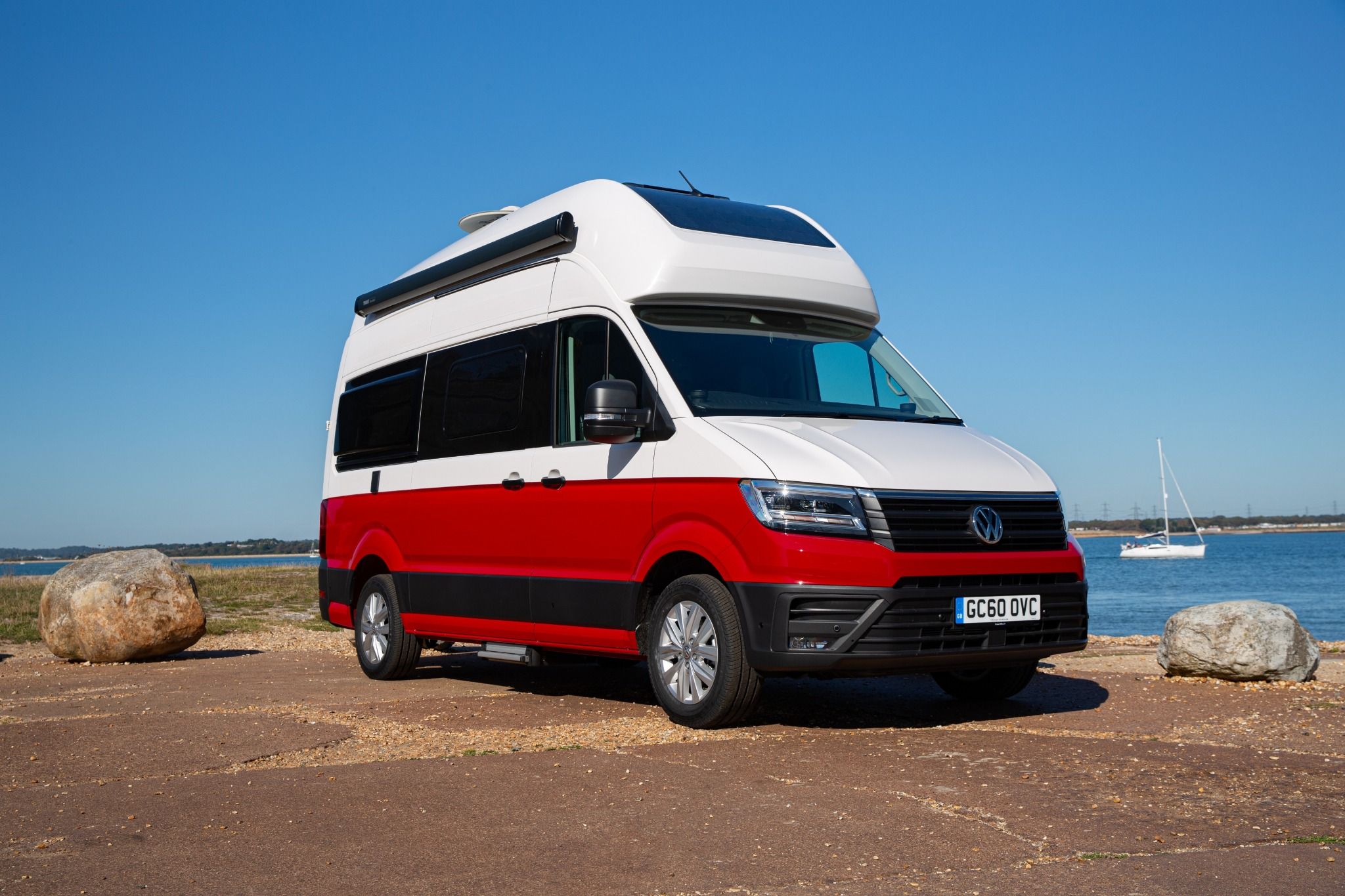 Red and White Volkswagen Grand California