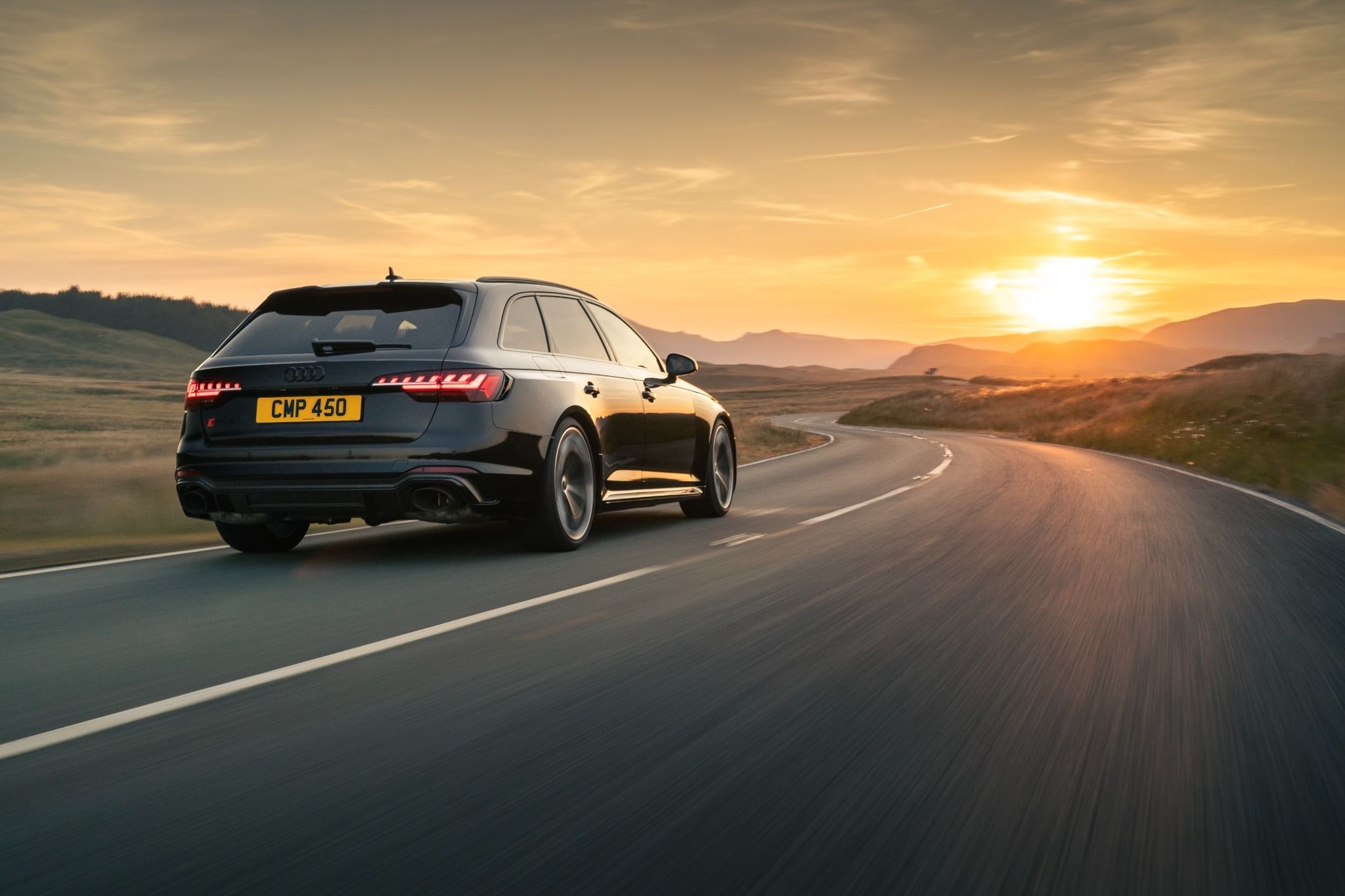 Black Audi RS4 Avant rear driving