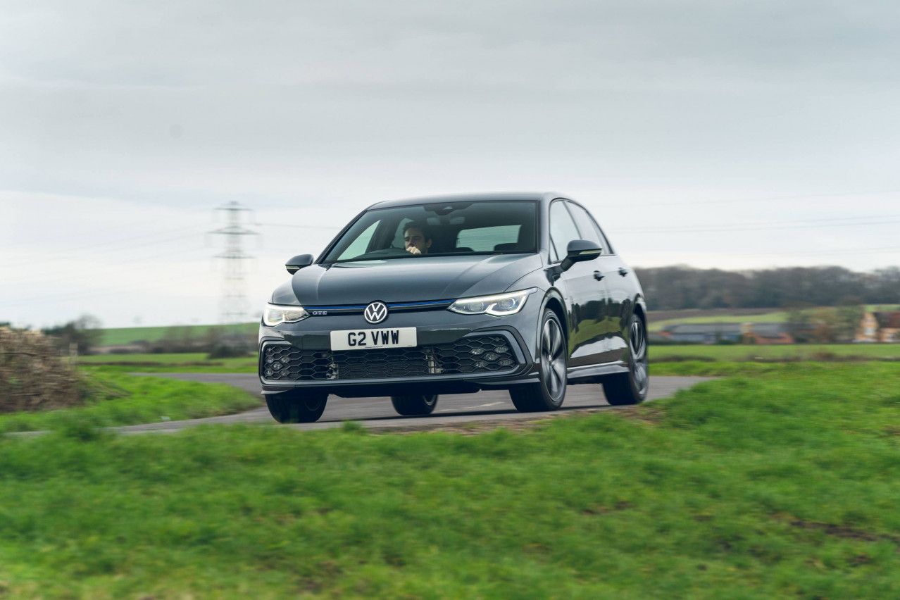 volkswagen golf gte driving on a road